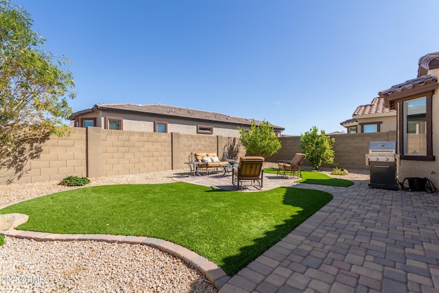 view of yard with a patio area and a fenced backyard