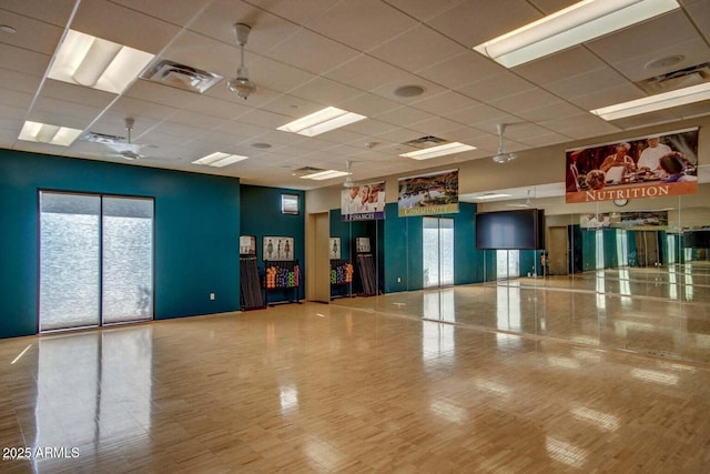 interior space featuring visible vents and a paneled ceiling