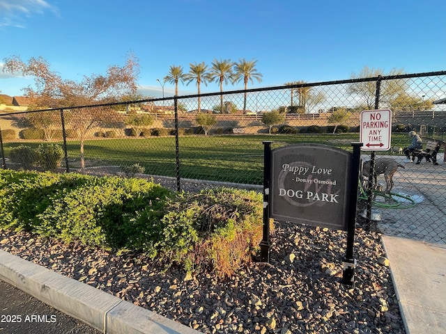 view of community featuring fence