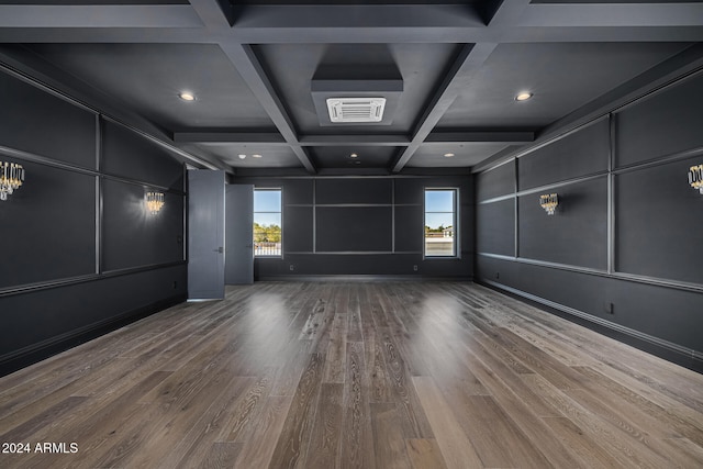 unfurnished room with coffered ceiling, wood-type flooring, and plenty of natural light