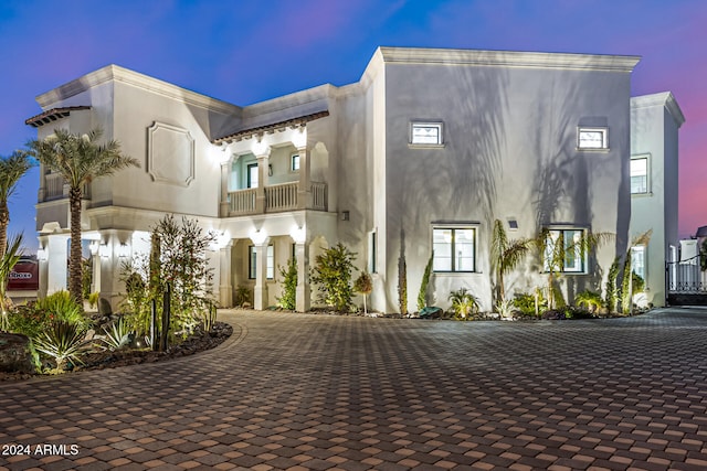 view of front of house with a balcony