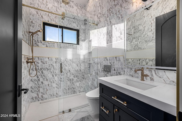 bathroom featuring a tile shower, vanity, tile walls, and toilet