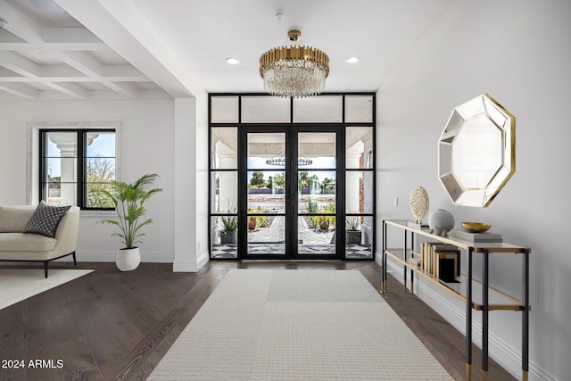 foyer featuring coffered ceiling, beam ceiling, dark wood-type flooring, and french doors