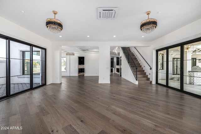 unfurnished living room with dark wood-type flooring