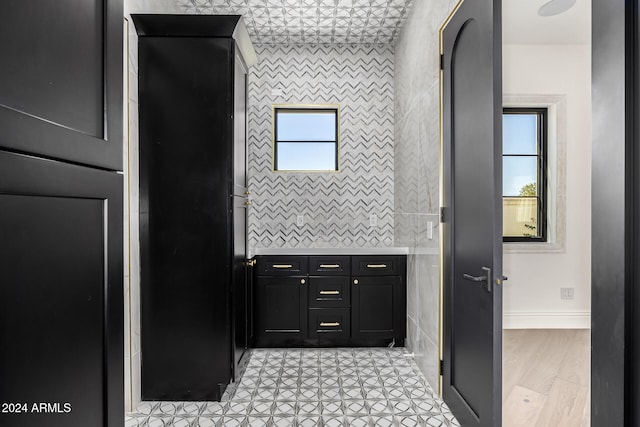 bathroom with tile walls