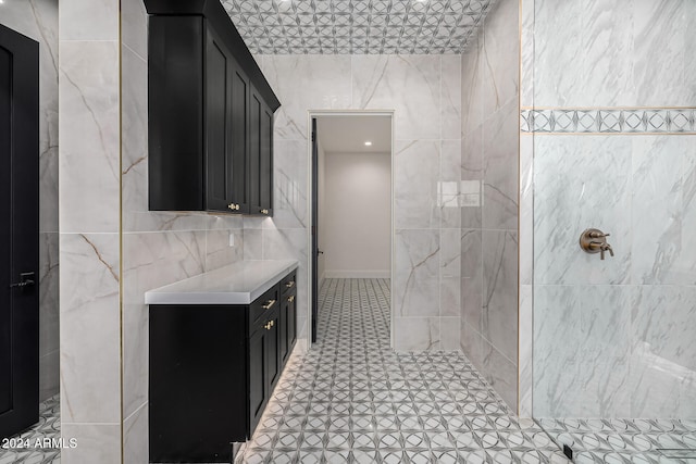 bathroom featuring walk in shower and tile walls