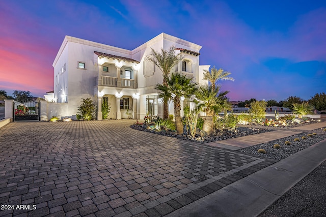 view of front of house with a balcony