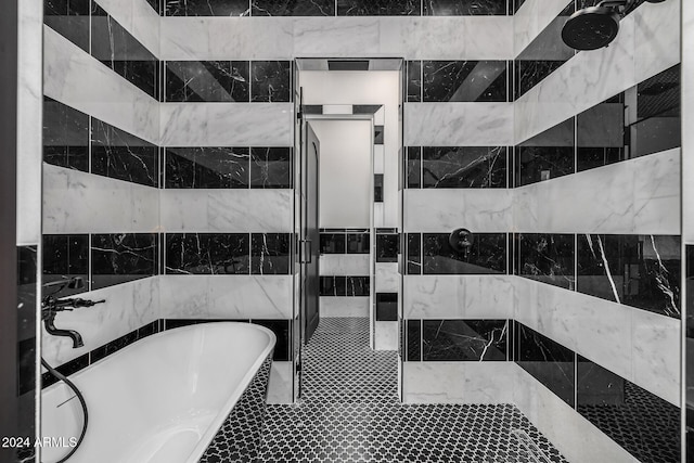 bathroom with tile walls and plus walk in shower