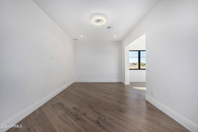 unfurnished room featuring dark hardwood / wood-style floors