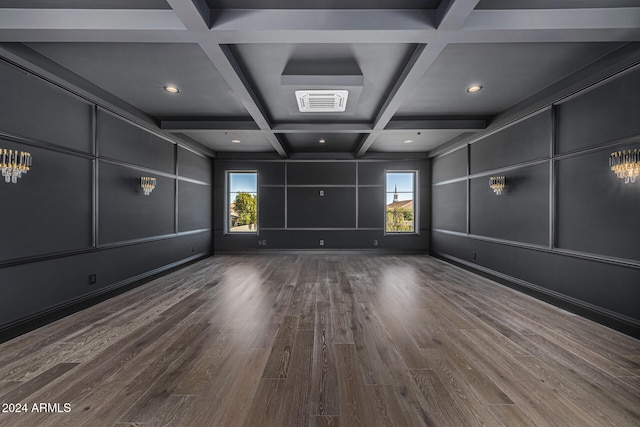 unfurnished room with coffered ceiling, beam ceiling, and hardwood / wood-style flooring