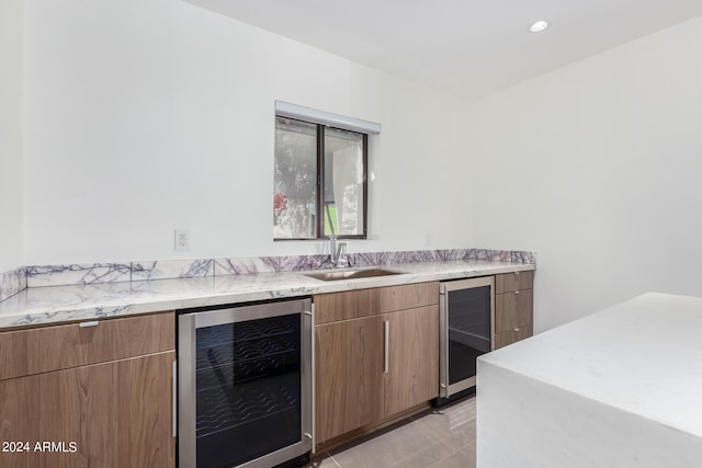 kitchen featuring wine cooler and sink