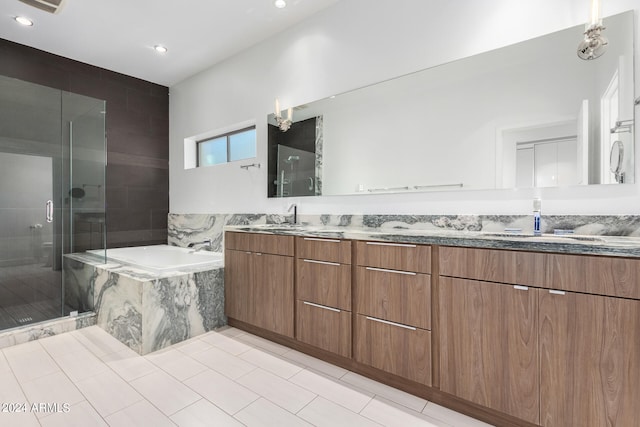 bathroom featuring vanity, plus walk in shower, and tile patterned flooring