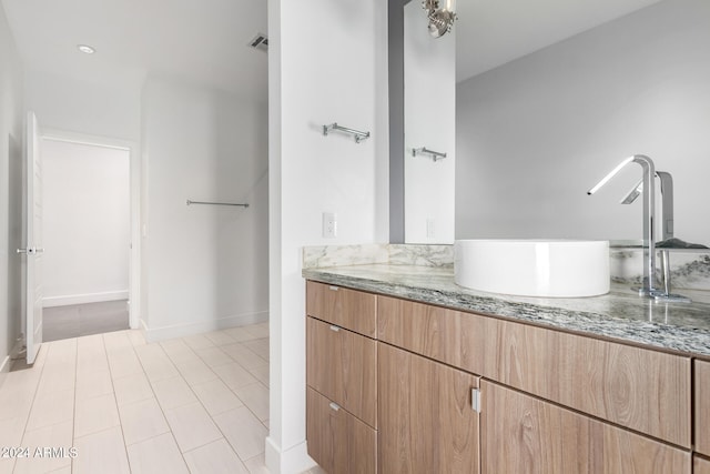 bathroom featuring vanity and tile patterned flooring