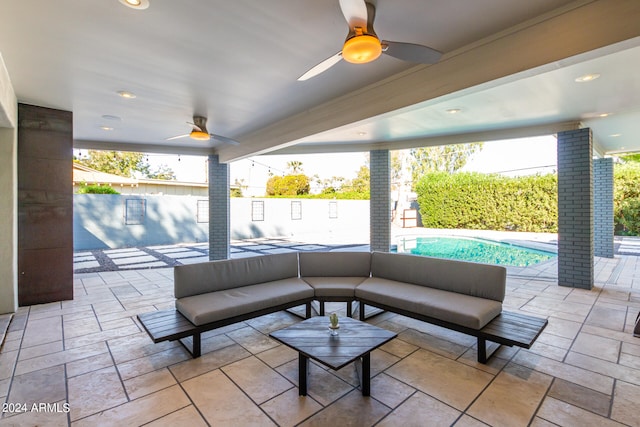 view of patio / terrace with a fenced in pool, an outdoor living space, and ceiling fan