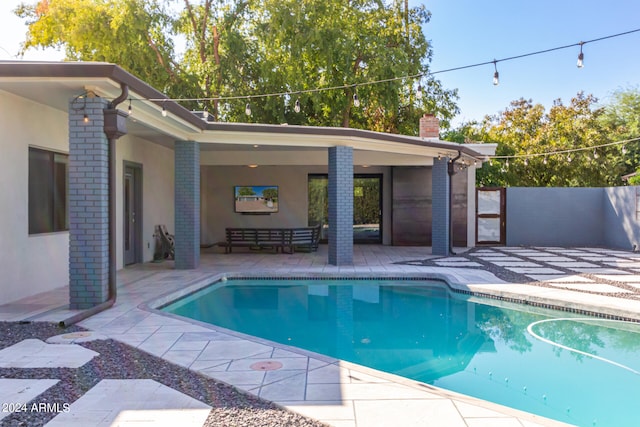 view of pool featuring a patio area