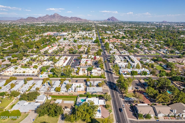 birds eye view of property featuring a mountain view