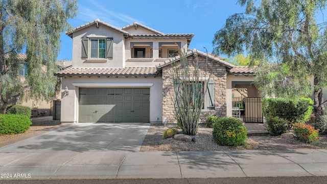 mediterranean / spanish house with a garage