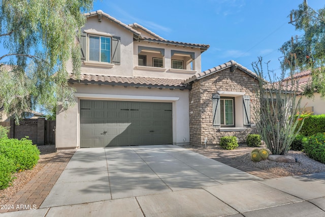 mediterranean / spanish-style home featuring a garage