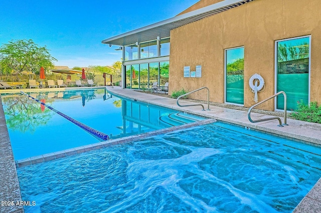 view of pool featuring a patio area