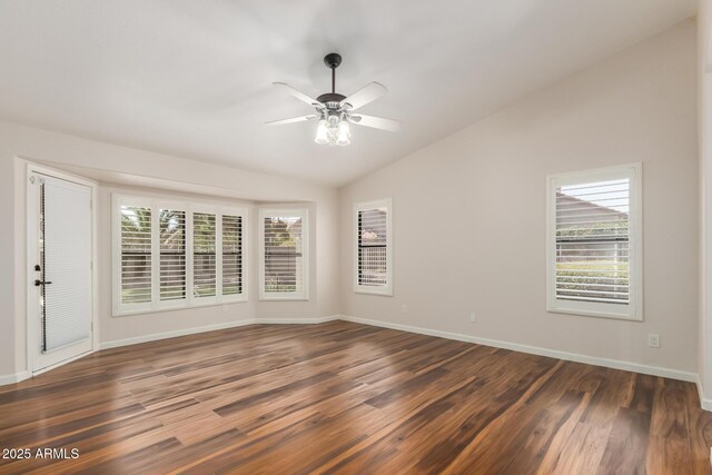 869 W Emerald Island Dr, Gilbert, AZ 85233 - spare room with lofted ceiling, healthy amount of natural light, dark wood-style flooring, ceiling fan, and baseboards