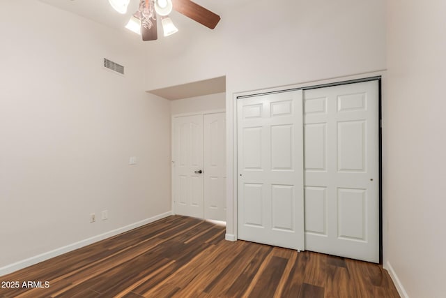 869 W Emerald Island Dr, Gilbert, AZ 85233 - unfurnished bedroom featuring baseboards, dark wood-style floors, a high ceiling, and ceiling fan
