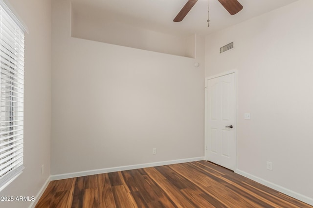 869 W Emerald Island Dr, Gilbert, AZ 85233 - unfurnished room with dark wood-style flooring, ceiling fan, and baseboards