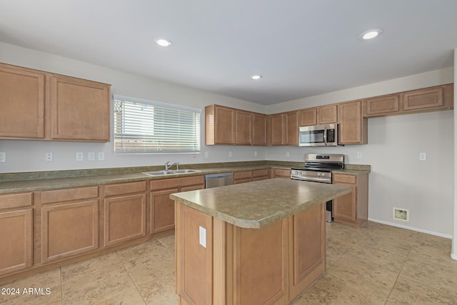 kitchen featuring a center island, stainless steel appliances, and sink