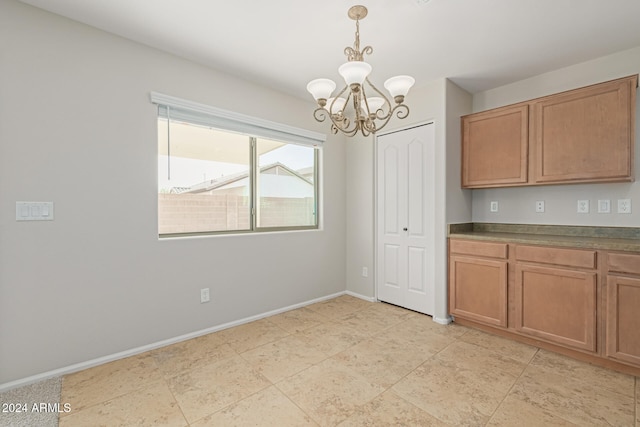 kitchen with a chandelier and hanging light fixtures