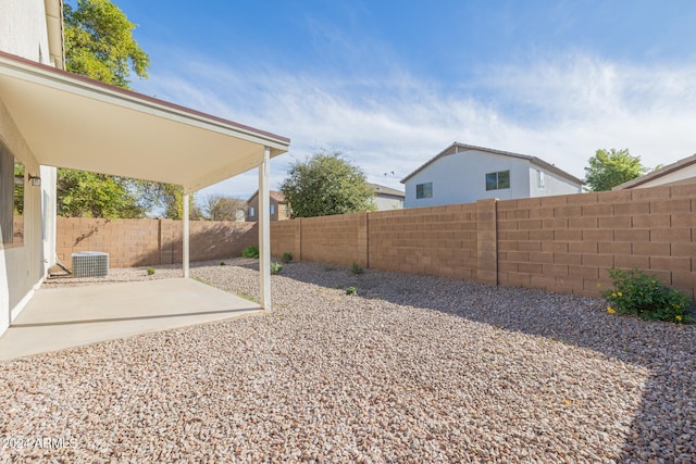 view of yard featuring a patio and central AC