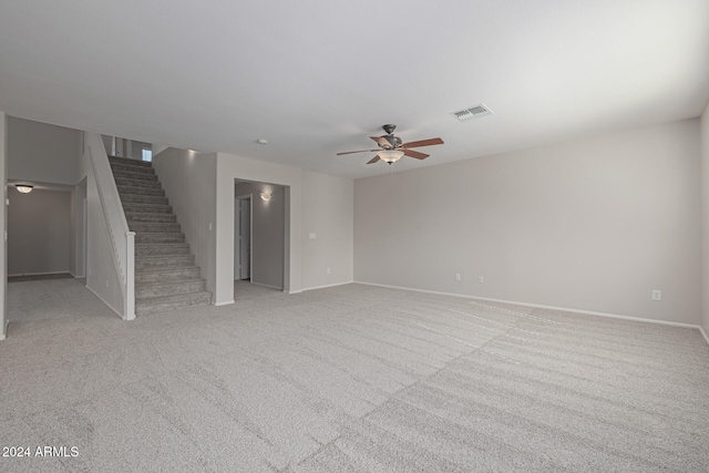 unfurnished living room with ceiling fan and light carpet
