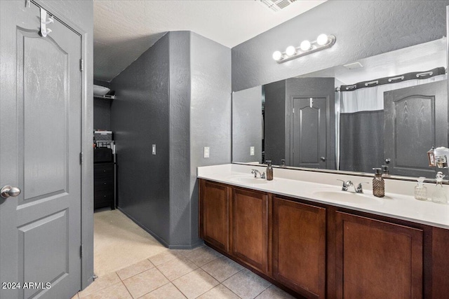 bathroom with vanity and tile patterned flooring