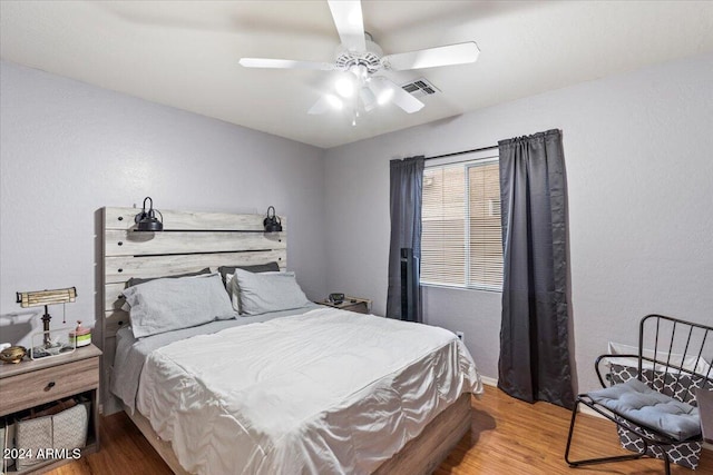 bedroom featuring wood-type flooring and ceiling fan