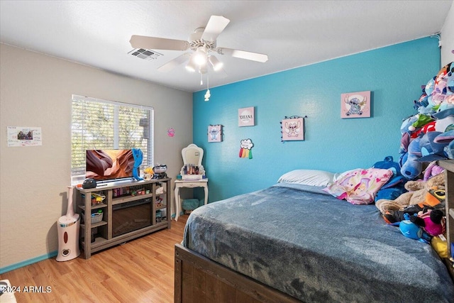 bedroom featuring light hardwood / wood-style flooring and ceiling fan