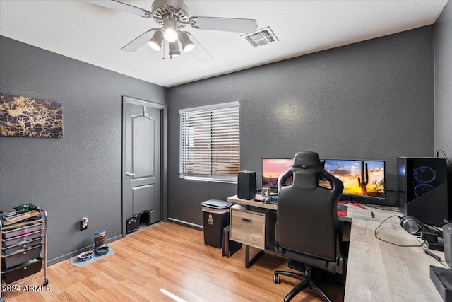 office area with light hardwood / wood-style floors and ceiling fan