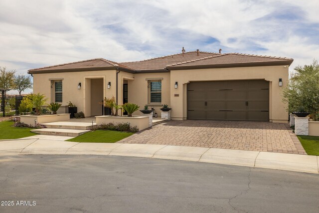 351 E Santa Lucia Ln, Queen Creek, AZ 85140 - view of front of property featuring fence, a tiled roof, decorative driveway, an attached garage, and stucco siding