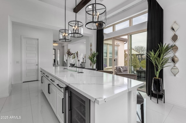 351 E Santa Lucia Ln, Queen Creek, AZ 85140 - kitchen with an inviting chandelier, baseboards, hanging light fixtures, beamed ceiling, and beverage cooler