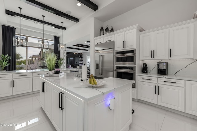 351 E Santa Lucia Ln, Queen Creek, AZ 85140 - kitchen featuring decorative backsplash, white cabinets, a center island, and appliances with stainless steel finishes