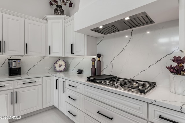 351 E Santa Lucia Ln, Queen Creek, AZ 85140 - kitchen with white cabinetry, stainless steel gas cooktop, light stone countertops, and premium range hood