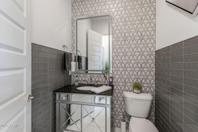 351 E Santa Lucia Ln, Queen Creek, AZ 85140 - bathroom with toilet, vanity, and tile walls