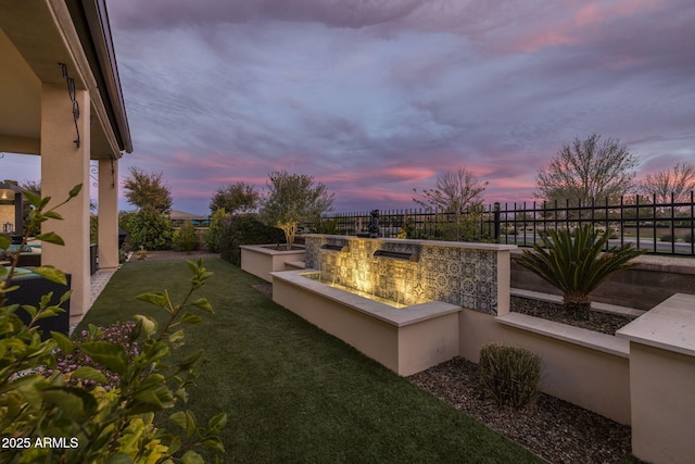 351 E Santa Lucia Ln, Queen Creek, AZ 85140 - yard at dusk featuring a patio and a fenced backyard