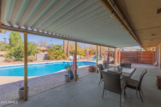 view of swimming pool featuring a patio, a fenced backyard, and a fenced in pool