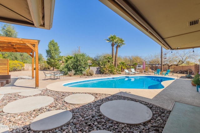 view of swimming pool featuring a patio, a fenced backyard, a fenced in pool, and a pergola