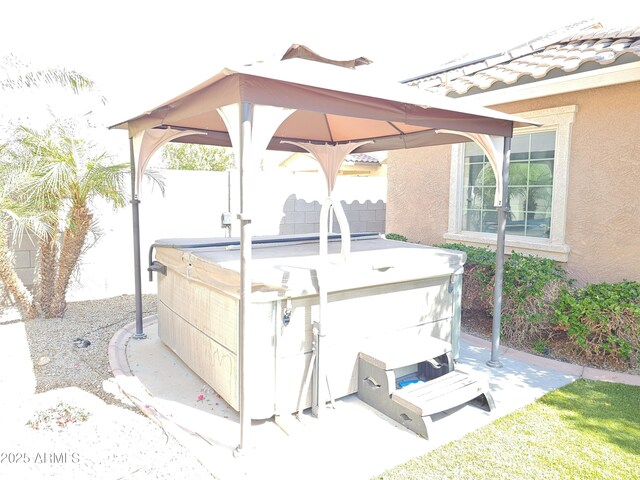 2678 S 172nd Dr, Goodyear, AZ 85338 - view of patio featuring a hot tub, a gazebo, and fence
