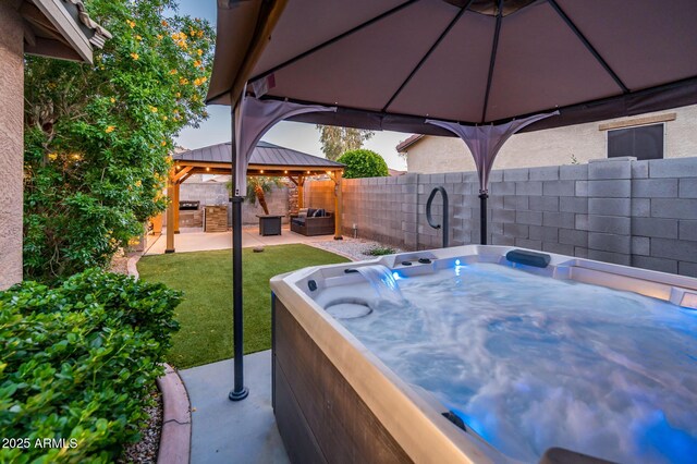 2678 S 172nd Dr, Goodyear, AZ 85338 - view of patio / terrace featuring a gazebo, a hot tub, and outdoor lounge area