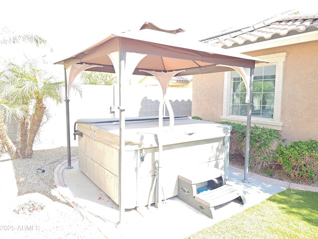 2678 S 172nd Dr, Goodyear, AZ 85338 - view of patio featuring a hot tub, a gazebo, and fence