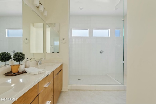 bathroom featuring vanity, tile patterned floors, and a shower with door