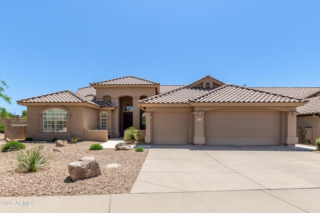 27953 N 111th Way, Scottsdale, AZ 85262 - mediterranean / spanish-style house with stucco siding, a garage, driveway, and a tiled roof