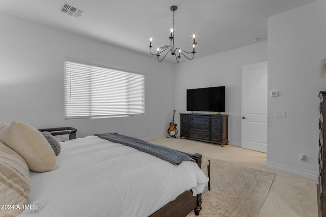 bedroom featuring light colored carpet and a chandelier