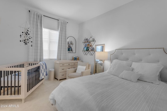 bedroom with light colored carpet