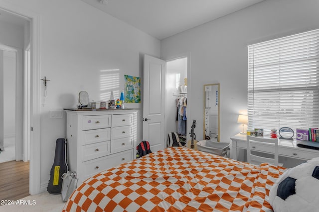 bedroom featuring light carpet